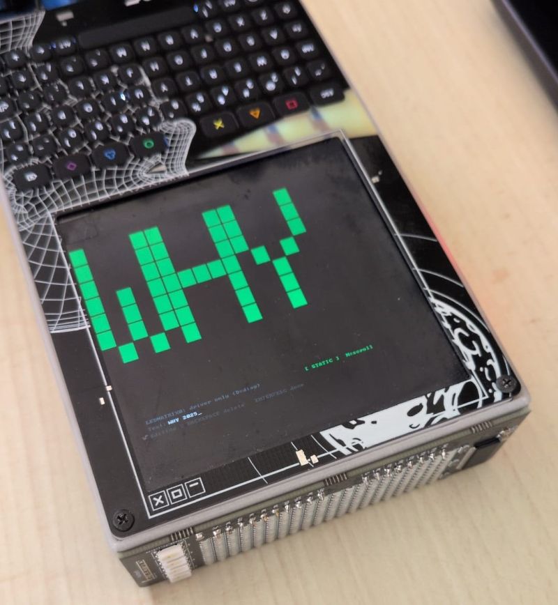 Image 3: LED-matrix add-on mounted on the badge, intended as a scroller